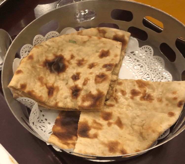 image description: a bowl of paratha bread