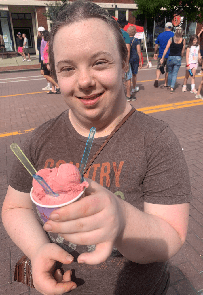 alt text: I am standing on the street in East Aurora enjoying my gelato.