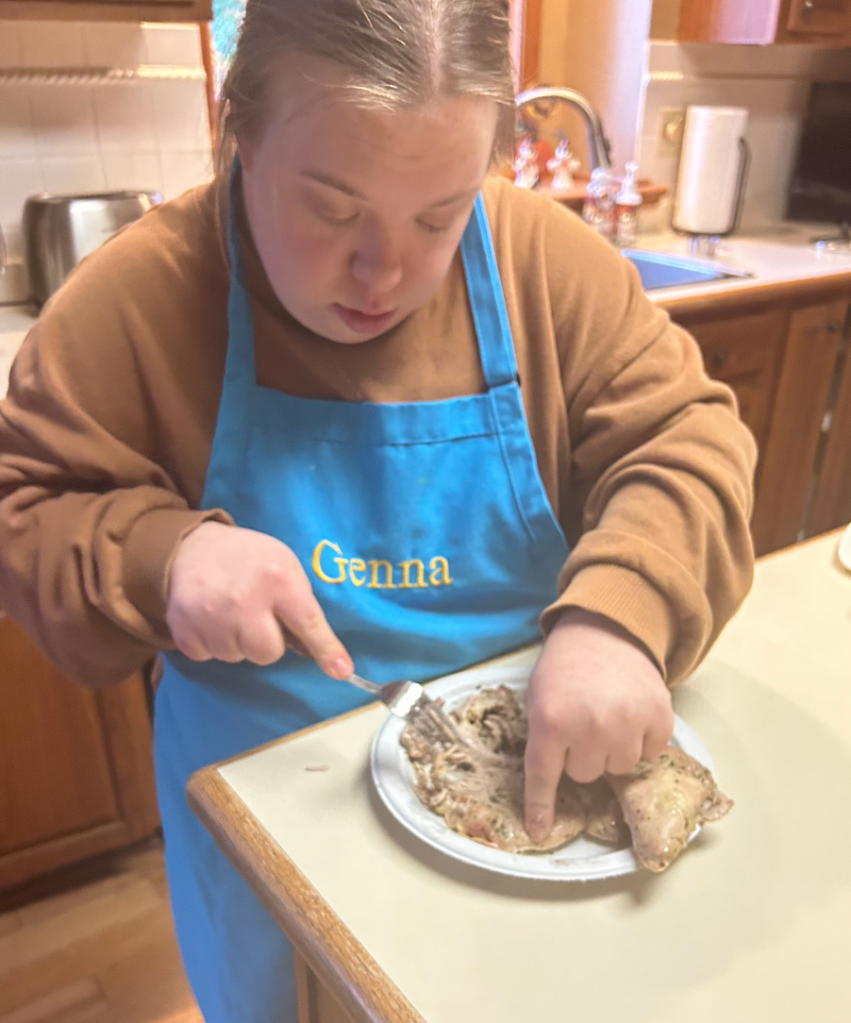 alt text: I am shredding the chicken thighs before mixing with the veggies and rice.