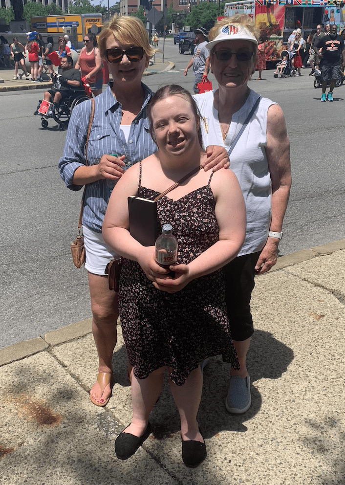 I am standing with my mom and grandma at the Taste of Buffalo Festival