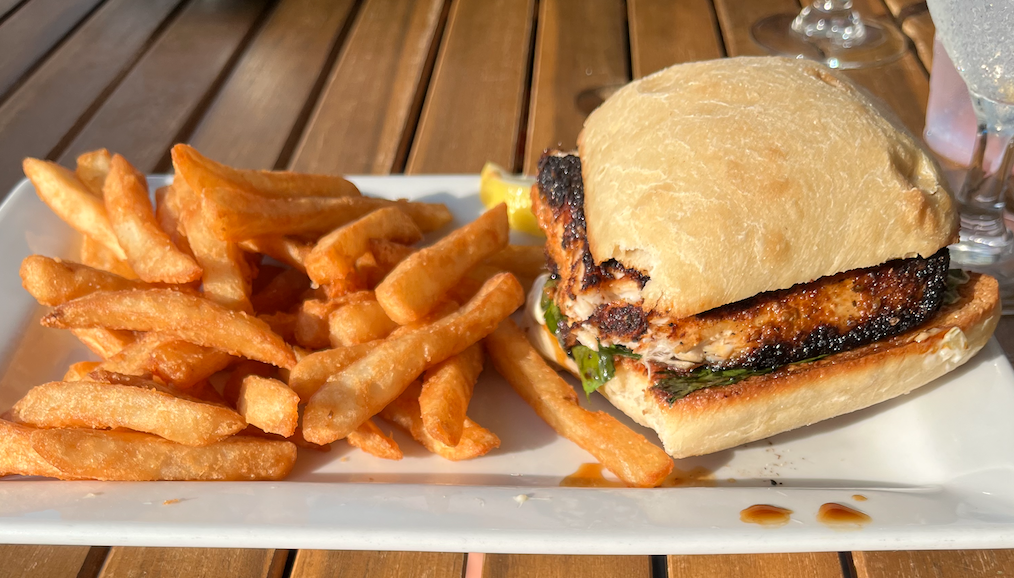alt text: my plate of a blackened mahi mahi on a bun and crispy french fries
